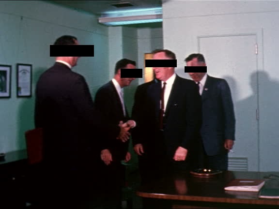 Unknown businessmen shaking hands circa 1984.